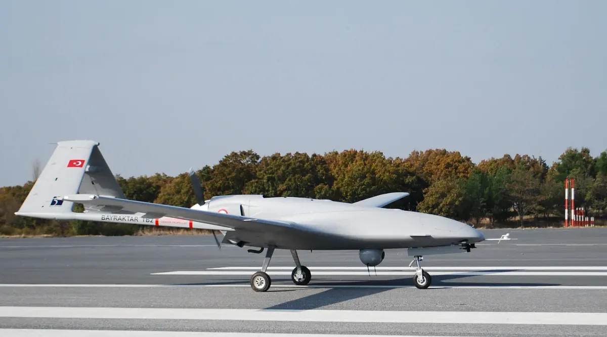 Bayraktar TB2 drone with laser-guided munitions on underwing hardpoints in flight
