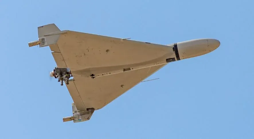 Shahed-136 drone on launch ramp at night, exhaust visible, military operation