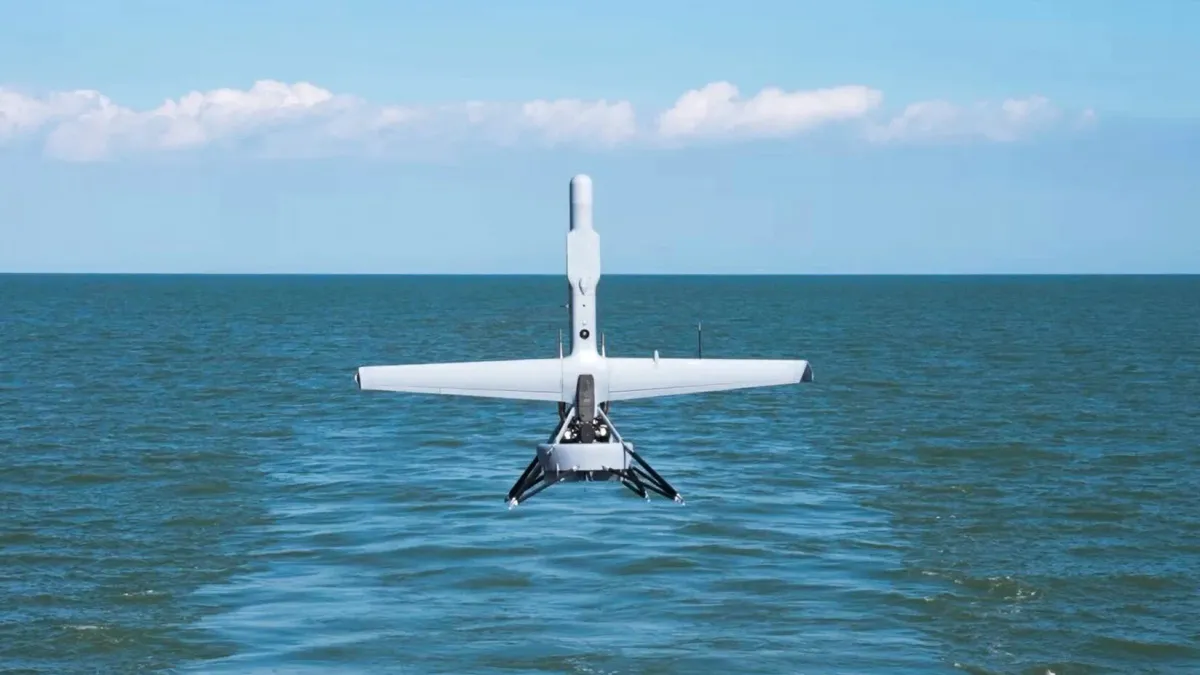 Shield AI V-BAT VTOL drone launching from a Navy ship deck during maritime ISR operations