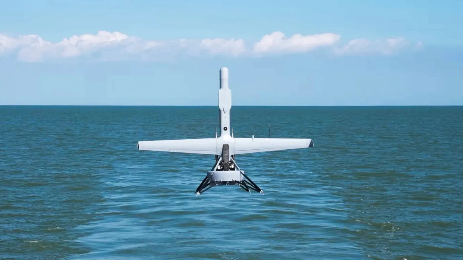 Shield AI V-BAT VTOL drone launching from a Navy ship deck during maritime ISR operations
