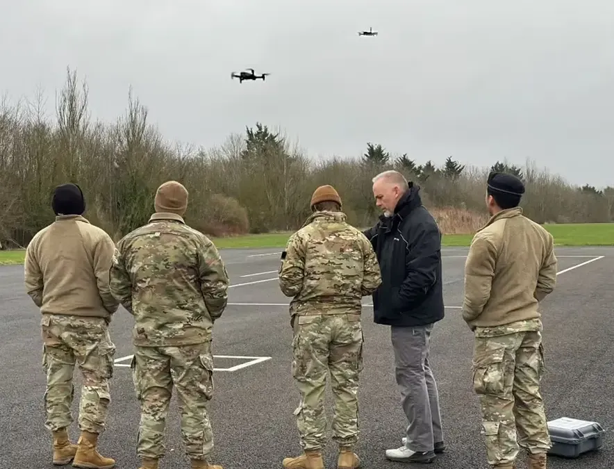Multiple autonomous drones coordinating over an urban area during a public safety response operation