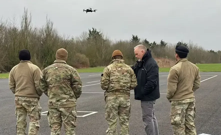 Multiple autonomous drones coordinating over an urban area during a public safety response operation