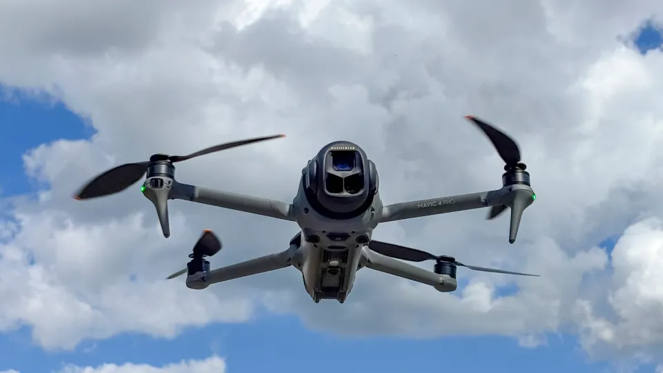 Unusual Machines NDAA-compliant drone components for counter-UAS interceptor systems on assembly workbench