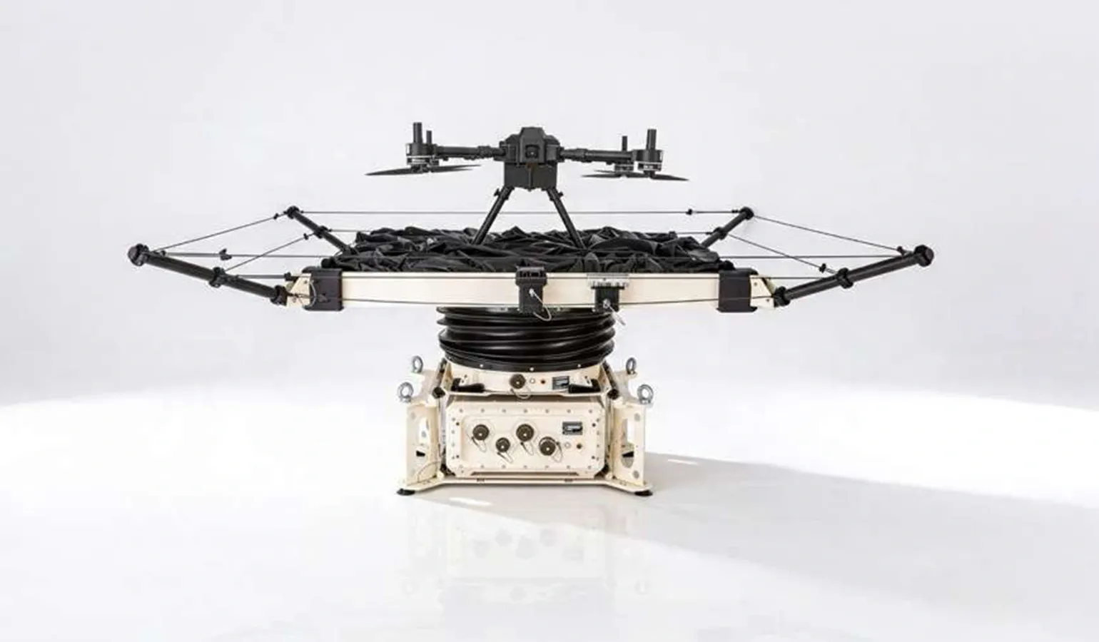 Gyro-stabilized drone landing pad mounted on a small offshore vessel in open water