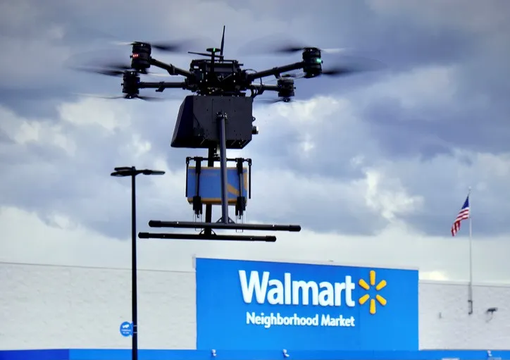 DroneUp Prism V2 drone in flight over a suburban delivery area