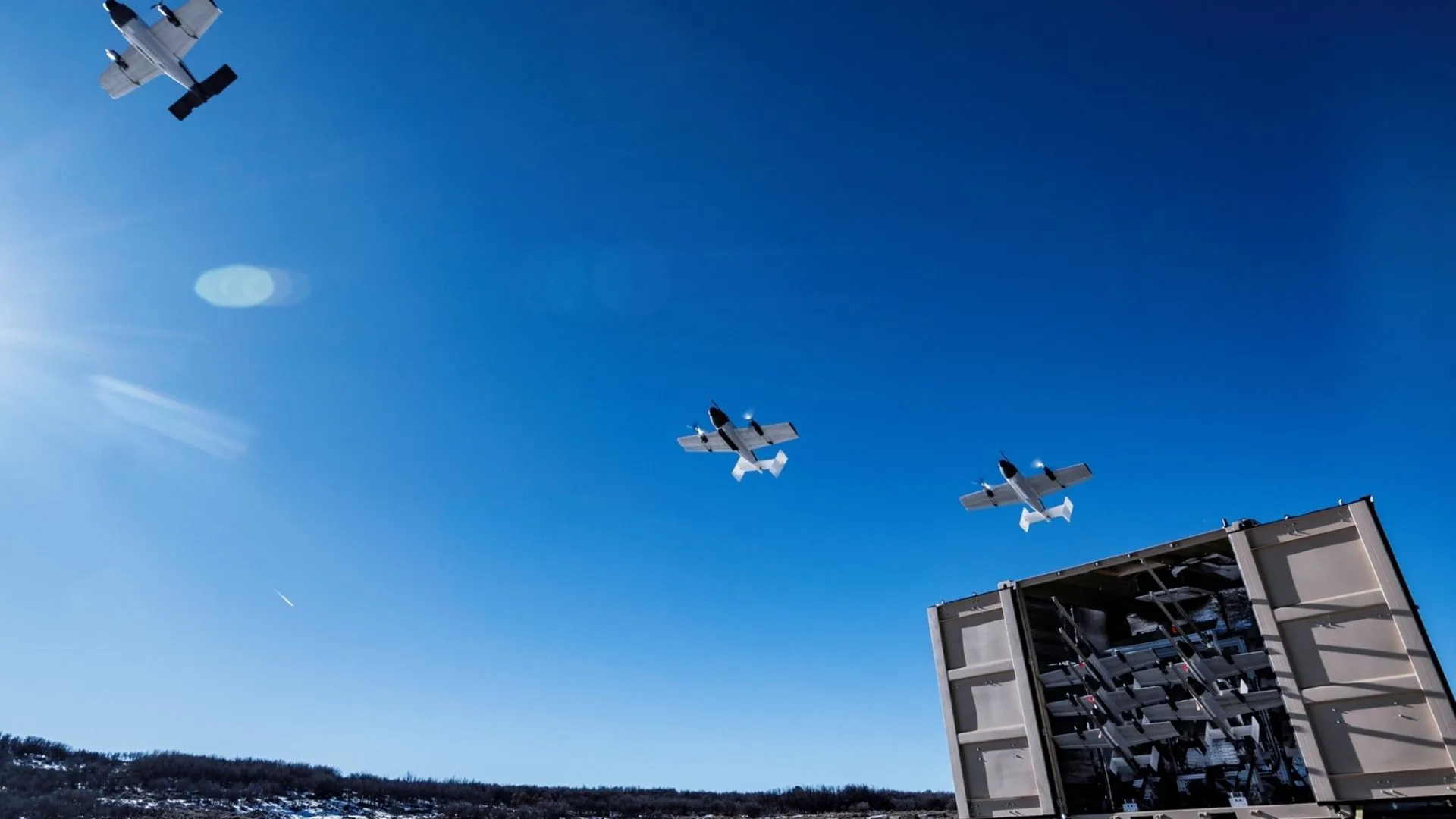Blitz expendable attack drones launching from BlitzBox ISO container launcher system