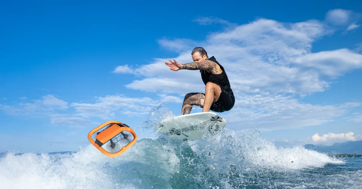 HoverAir AQUA waterproof self-flying drone launching off a wave