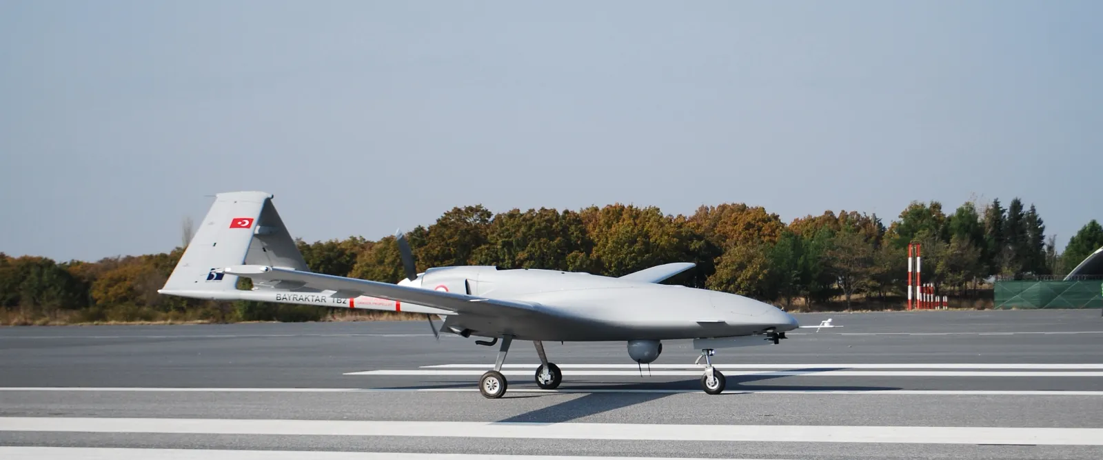 Bayraktar TB2 drone with laser-guided munitions on underwing hardpoints in flight