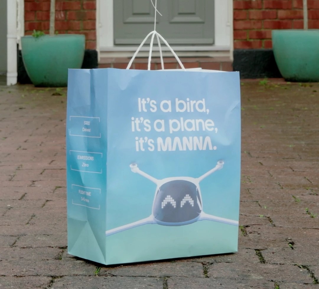 Manna drone delivering a package to a residential garden in Dublin Ireland