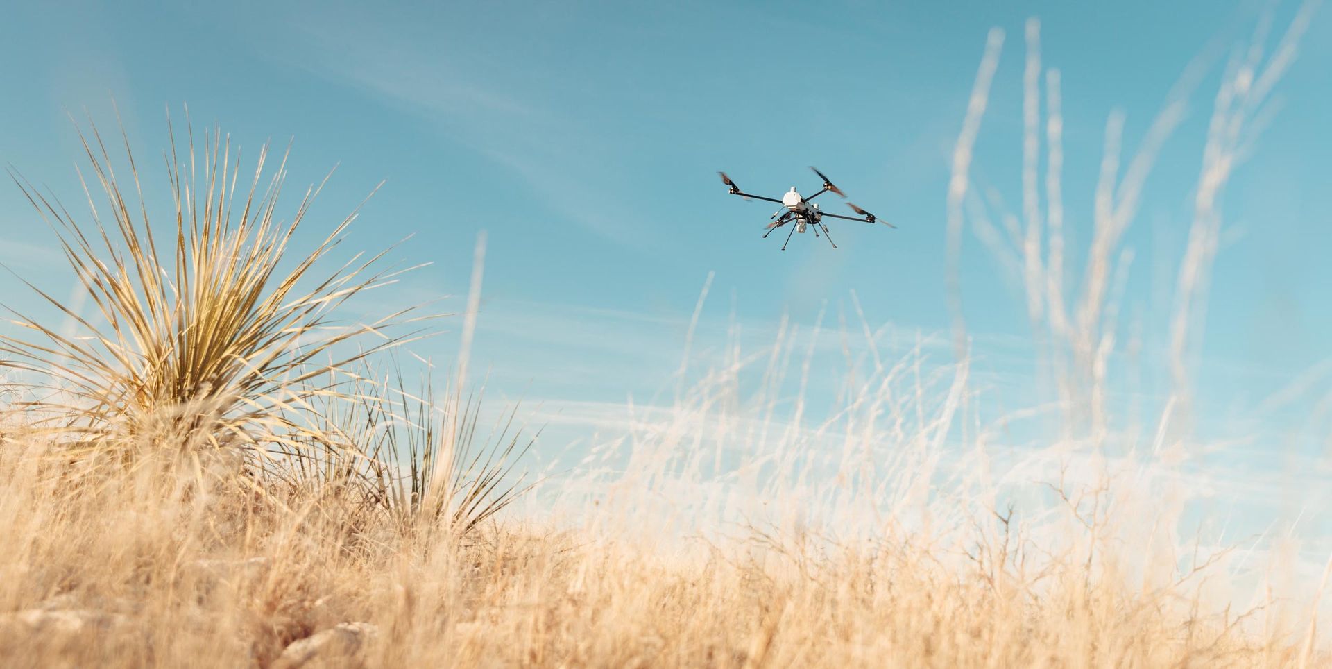 Small military drone in flight during a field test