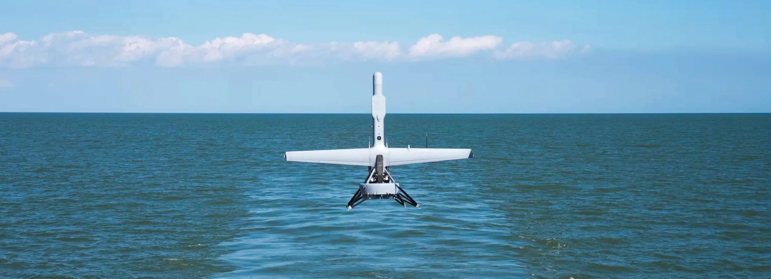 Shield AI V-BAT VTOL drone launching from a Navy ship deck during maritime ISR operations