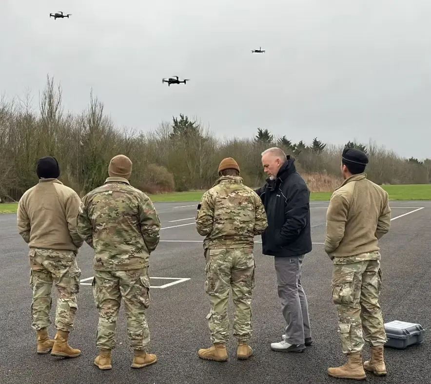 Multiple autonomous drones coordinating over an urban area during a public safety response operation