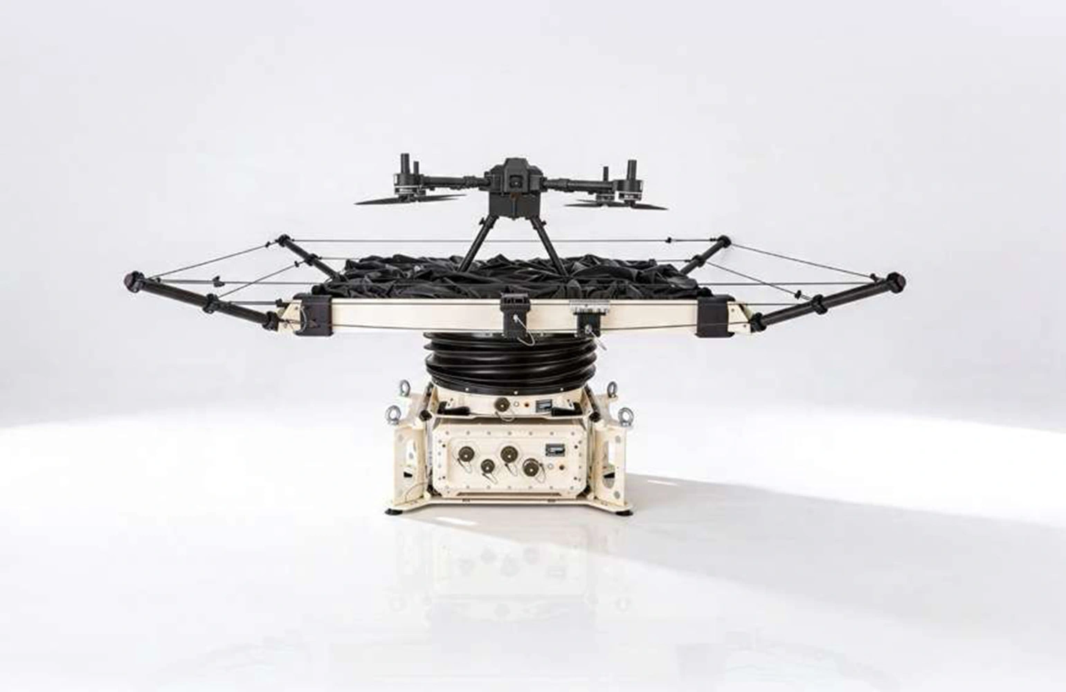 Gyro-stabilized drone landing pad mounted on a small offshore vessel in open water